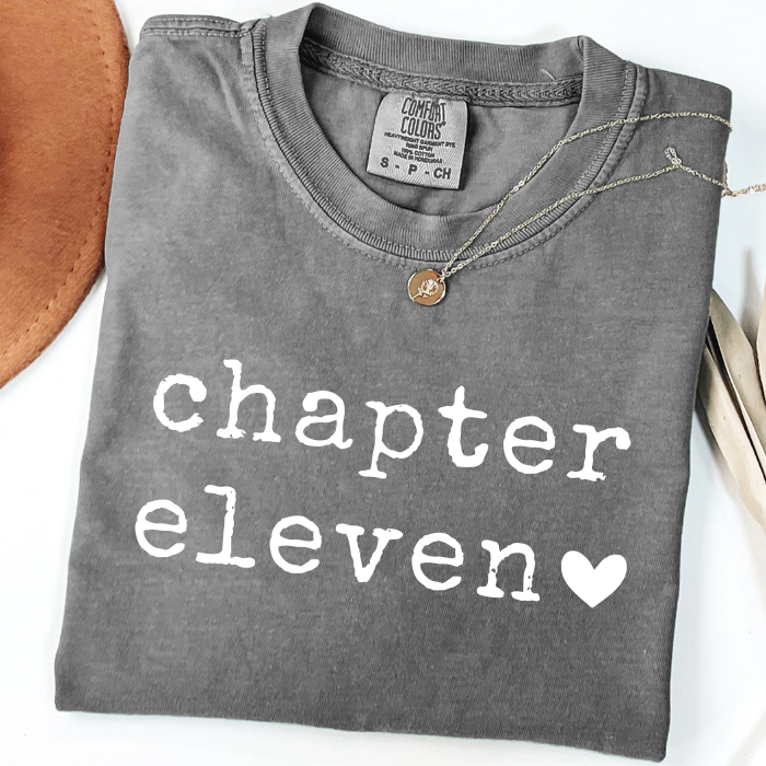 Gray Comfort Colors Chapter Eleven 11 birthday shirt with minimalist white text and heart graphic