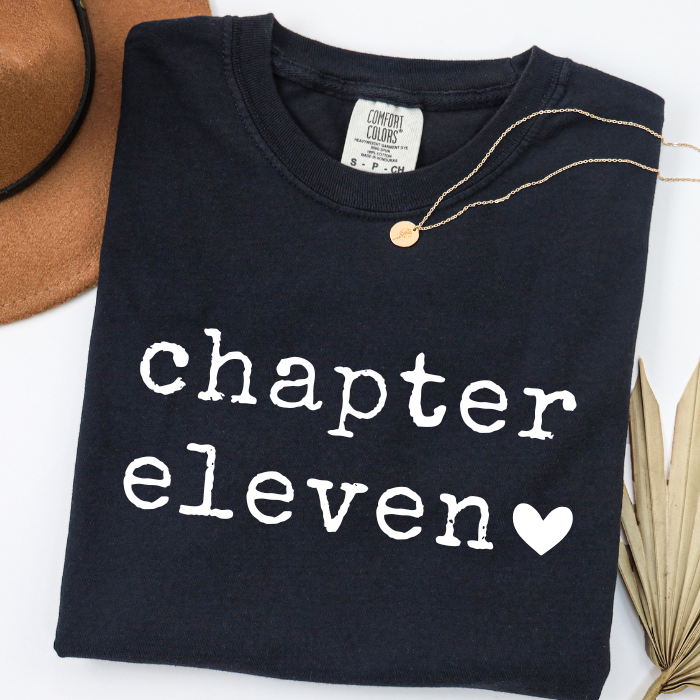Black Comfort Colors Chapter Eleven birthday shirt for girls with minimalist white typography
