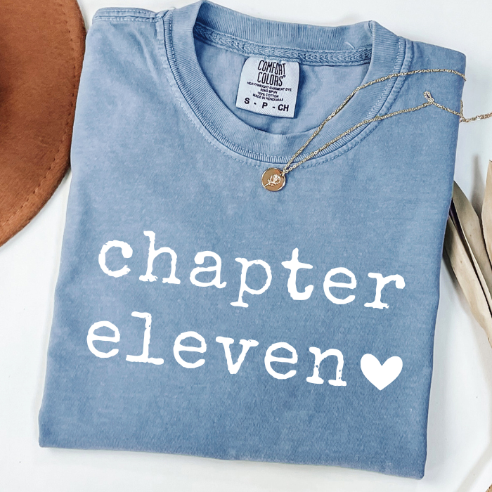 Blue Comfort Colors Chapter Eleven birthday shirt for girls with minimalist white typography