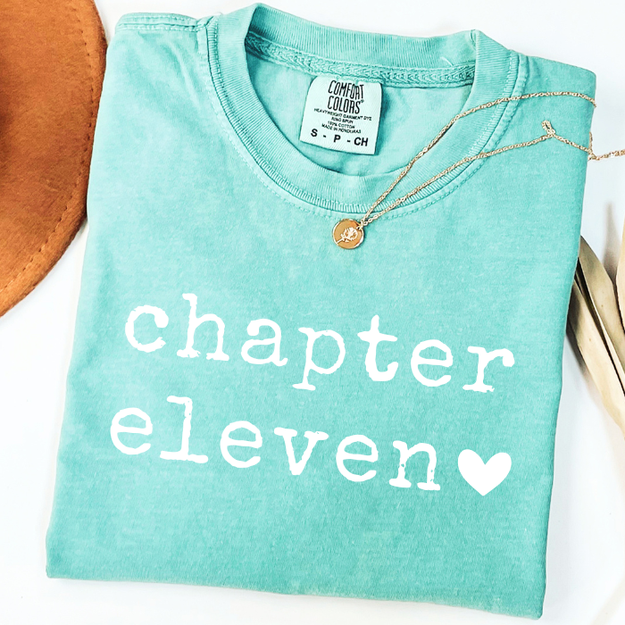 Mint green Comfort Colors Chapter Eleven 11th birthday tee featuring white vintage lettering and heart design