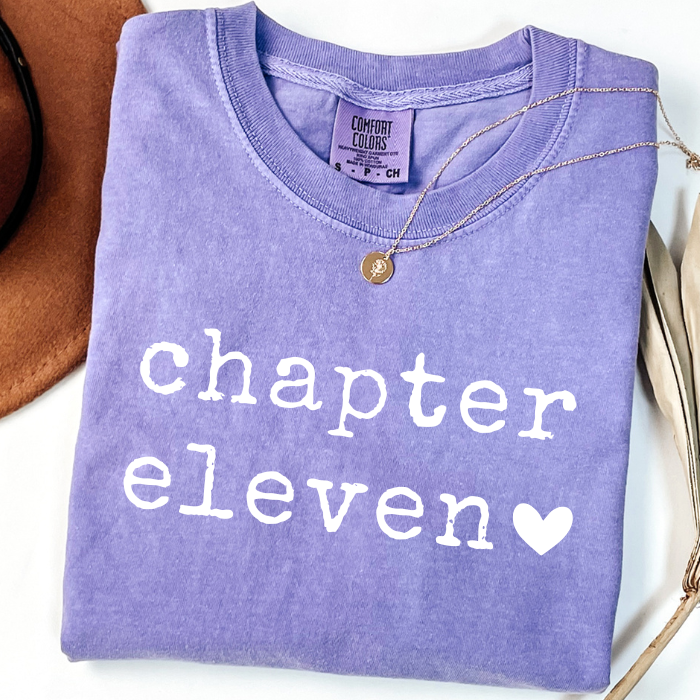 Purple Lavender Comfort Colors Chapter Eleven birthday shirt featuring white vintage lettering and heart graphic