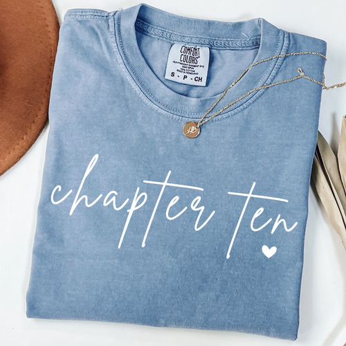 Blue Comfort Colors 10th birthday shirt for girls featuring white Chapter Ten script design