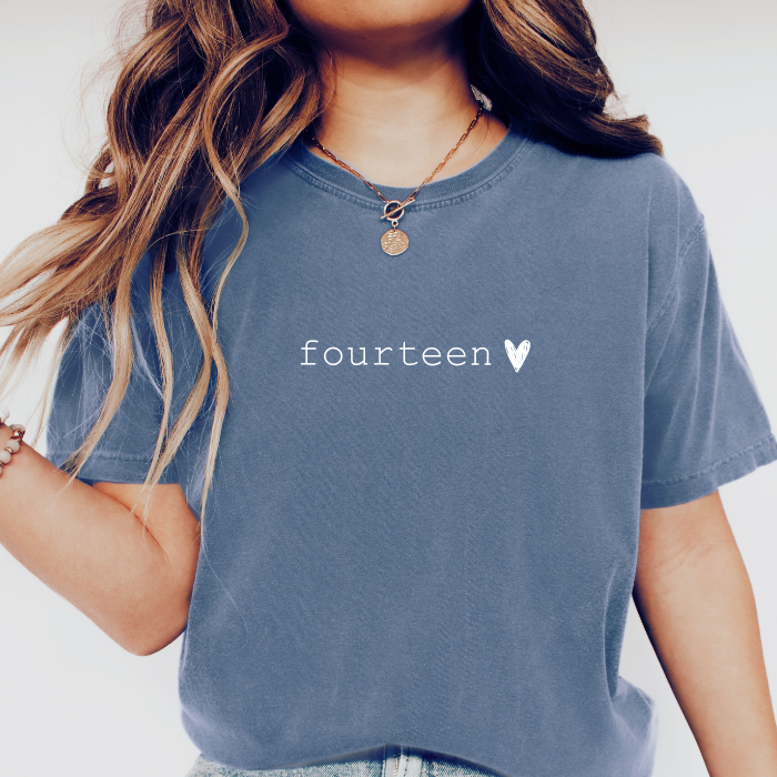 blue jean comfort colors shirt that says fourteen with a chalk heart